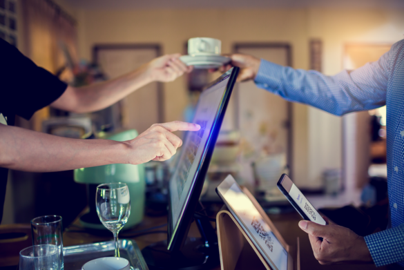 Customer paying at a restaurant with a QR code